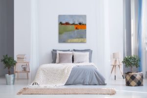 A Joyful Day painting by Michelle Andres shown on a bedroom wall